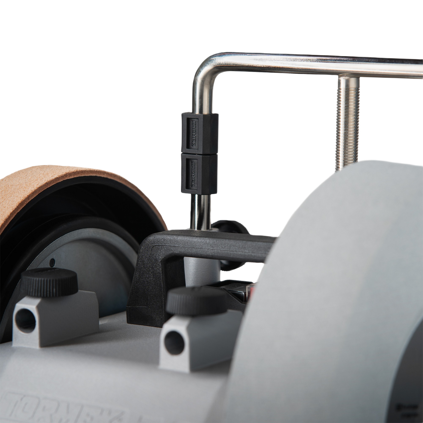 Close-up of black plastic tilt feet attached to metal frame on Tormek sharpening tool in woodworking accessories collection