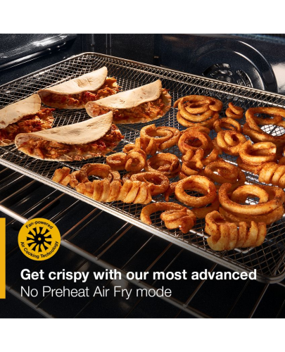 Crispy tacos and spiral-cut fried potatoes cooking on a wire rack inside a gas smart range oven.
