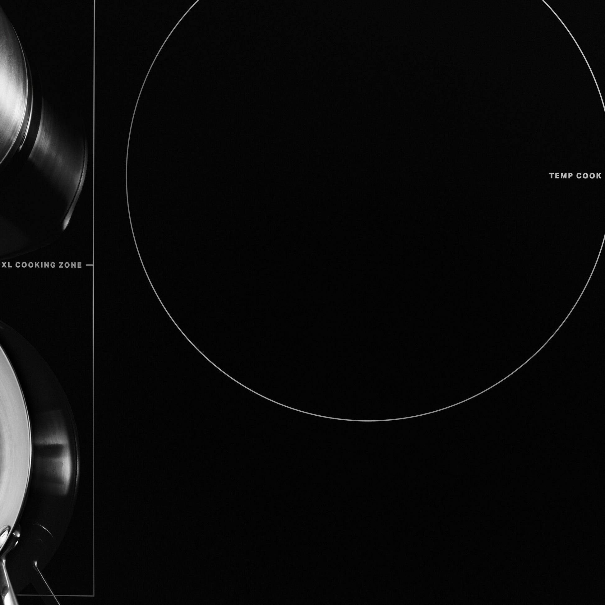 Close-up of black induction cooktop surface showing XL cooking zone and touch control area, kitchen appliance setting