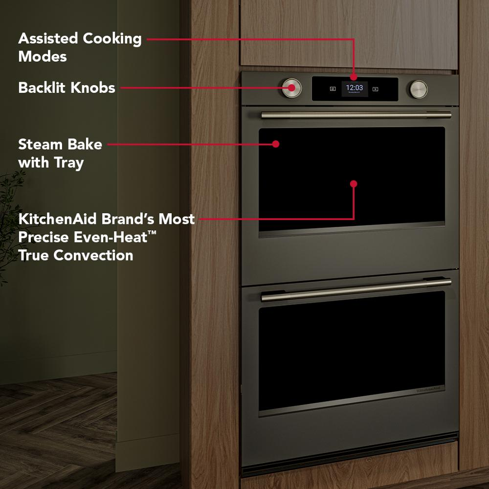 Built-in 30-inch black ore double wall oven with digital display, assisted cooking, and steam bake tray in modern kitchen
