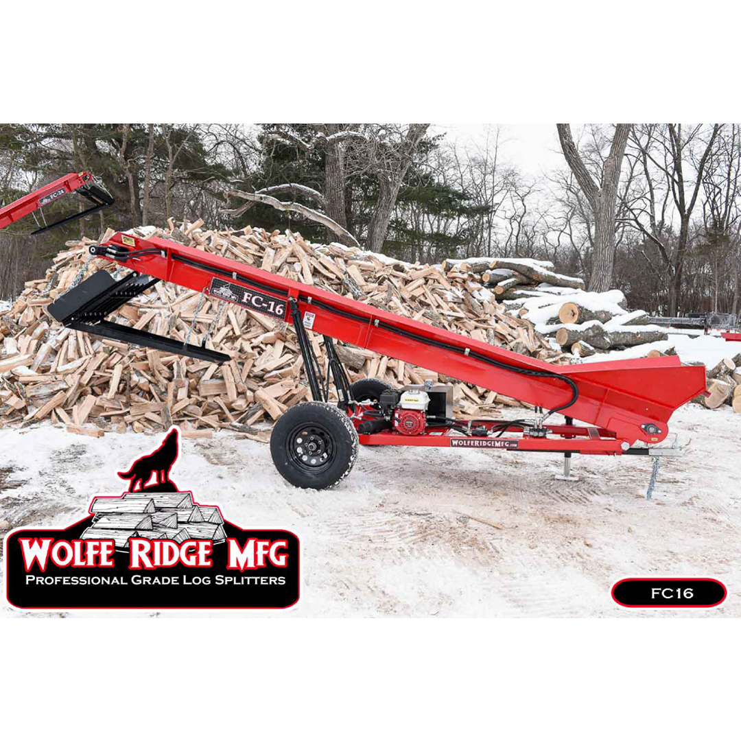 Red Wolfe Ridge conveyor designed for firewood handling, positioned outdoors near stacked logs and snow-covered ground