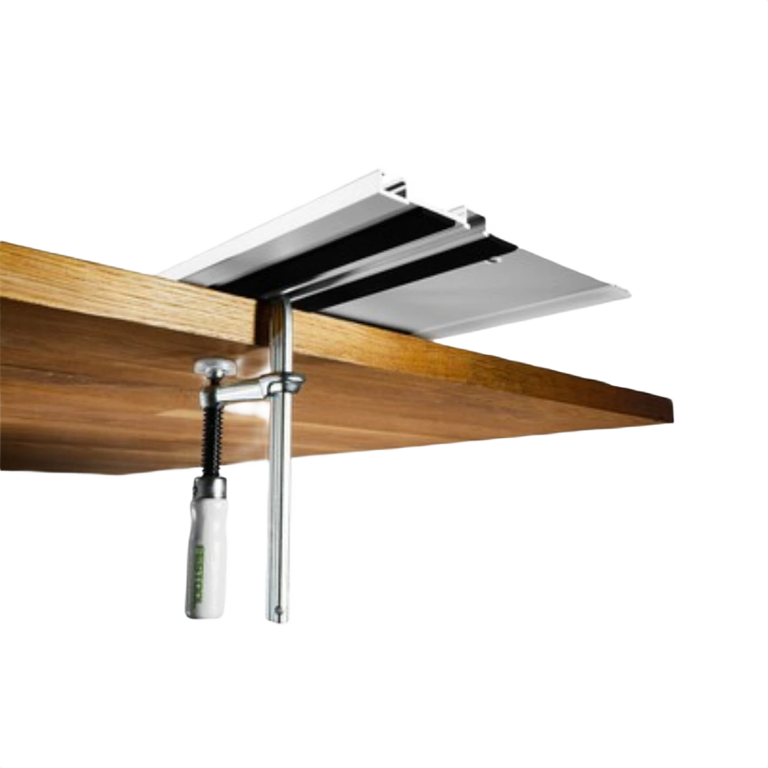 Metal screw clamp with white handle securing wooden board to aluminum guide rail in woodworking tool accessories collection