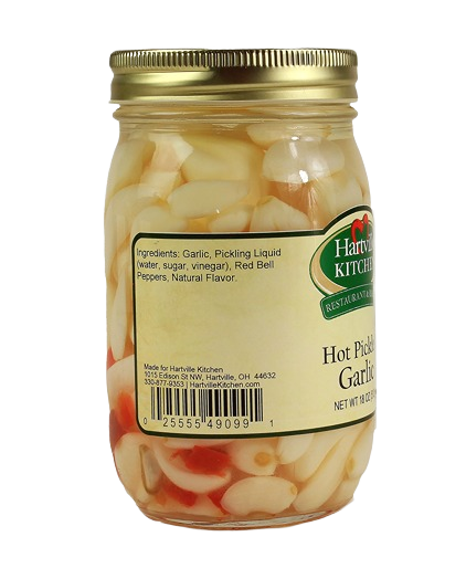 Clear glass jar of hot pickled garlic cloves with gold lid, part of Hartville Kitchen preserved goods under $50 collection