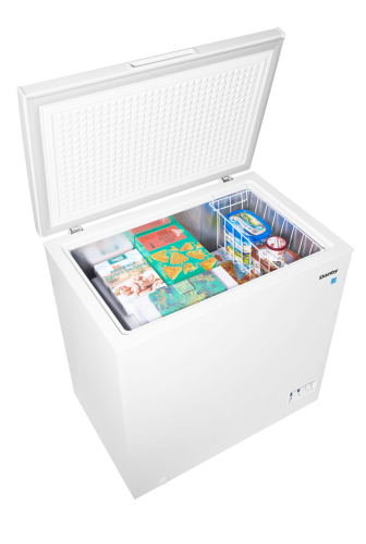 White chest freezer with opened lid showing assorted frozen food items and a removable wire basket inside