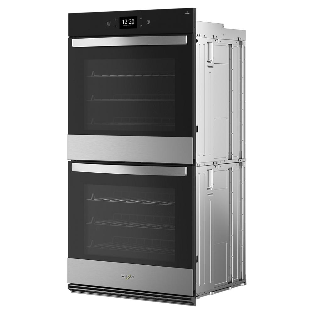 double stainless steel and black smart wall oven with digital display and multiple racks in kitchen appliances