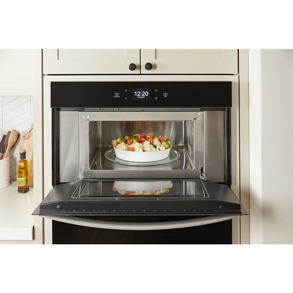 Built-in stainless steel microwave combo wall oven with digital display and dish inside from Kitchen & Kitchenware collection