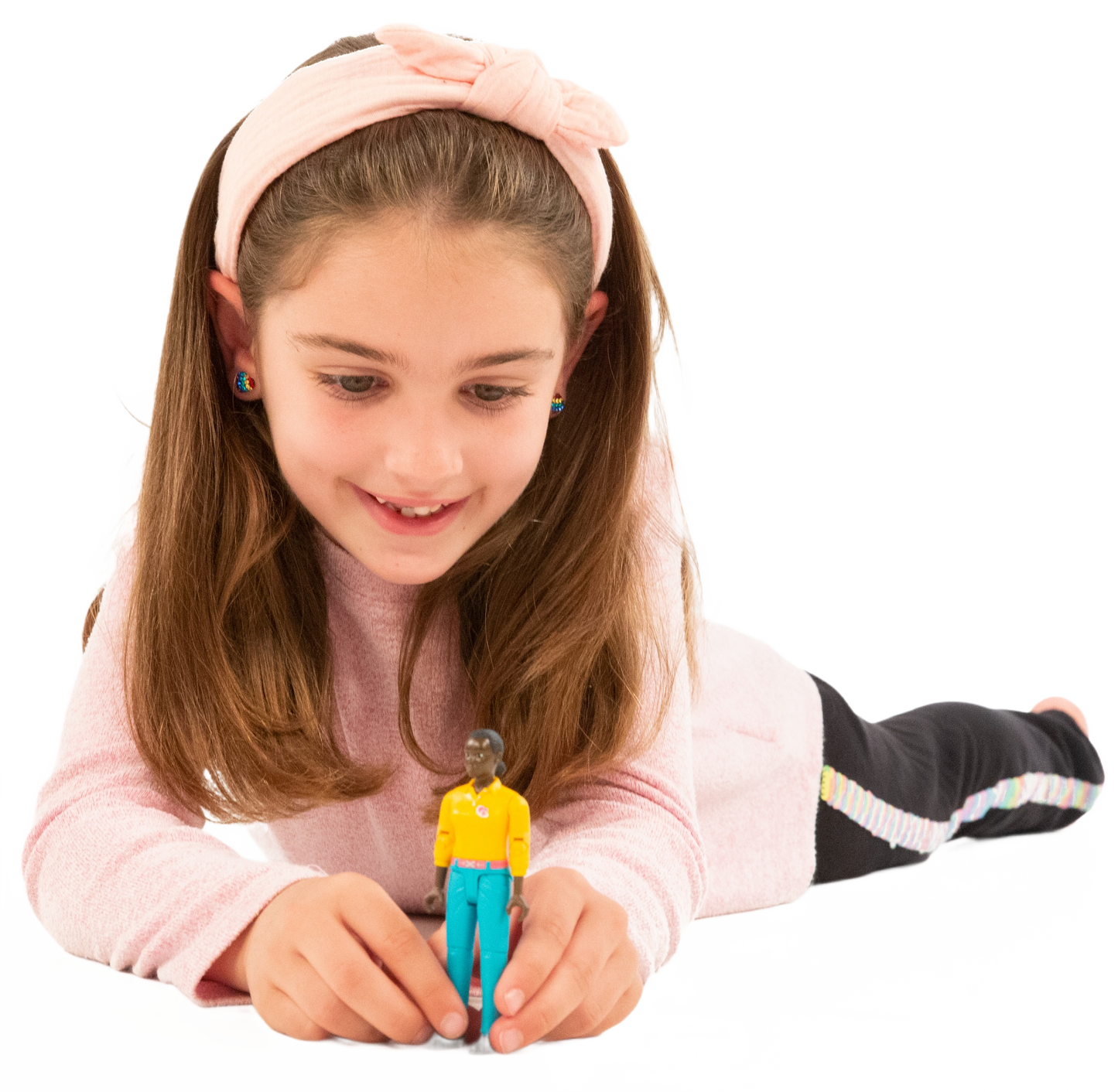 Young girl playing with Bruder Woman action figure wearing turquoise jeans and yellow top from Toys & Games collection