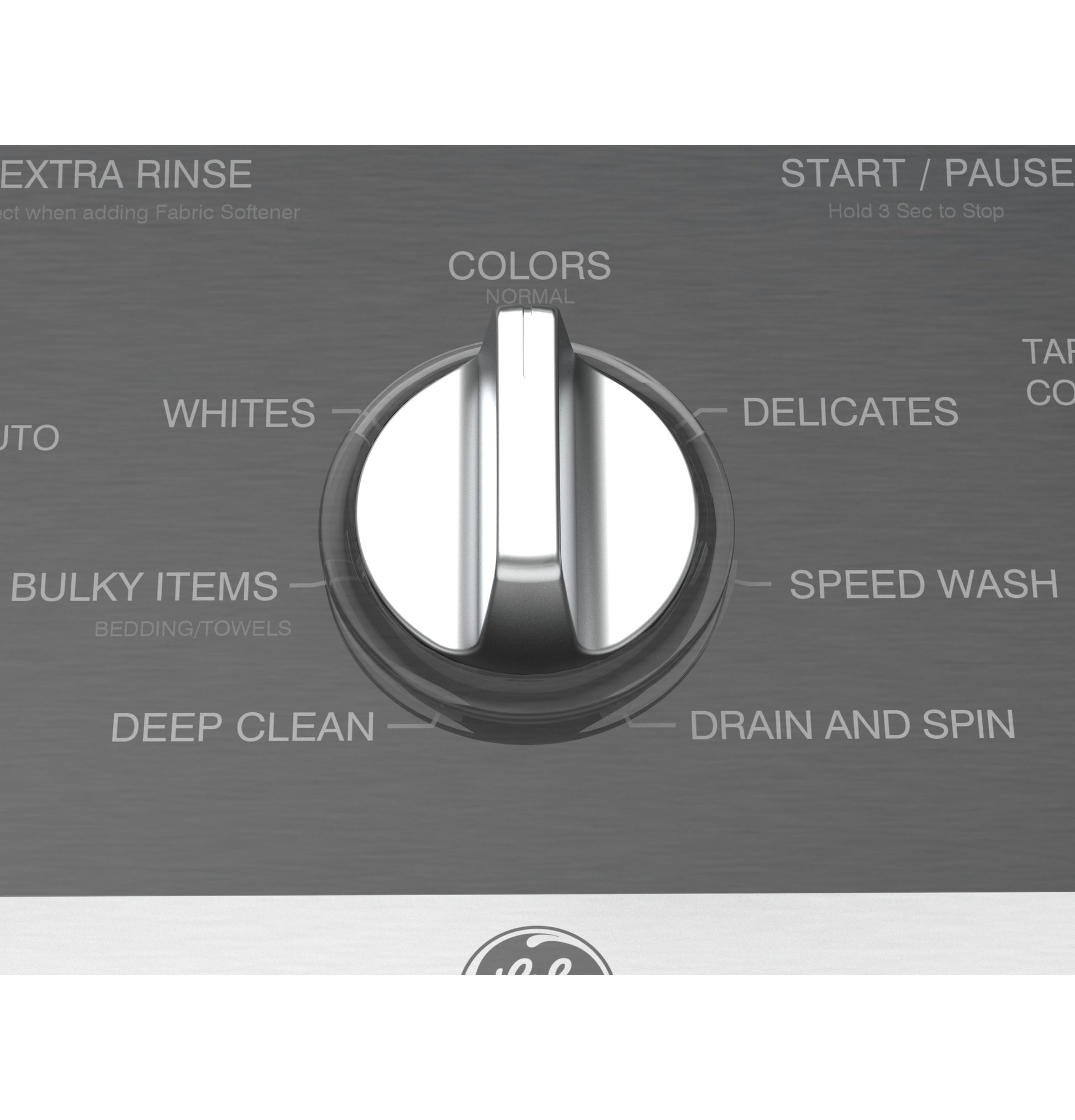 Close-up of stainless steel washer control knob with cycle options including colors, whites, delicates, and speed wash