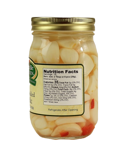 Glass jar of hot pickled garlic cloves with gold lid, part of Hartville Kitchen preserved goods under $50 collection