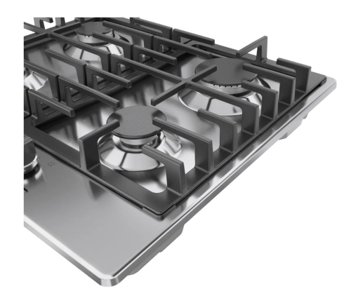 Close-up view of stainless steel gas cooktop with cast iron grates and metal control knobs in kitchen appliances collection