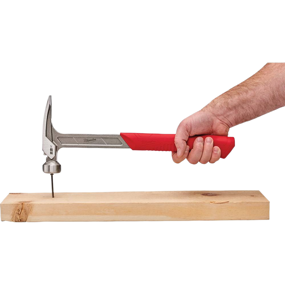 Hand gripping smooth face framing hammer with red handle driving nail into wooden plank for home improvement tasks