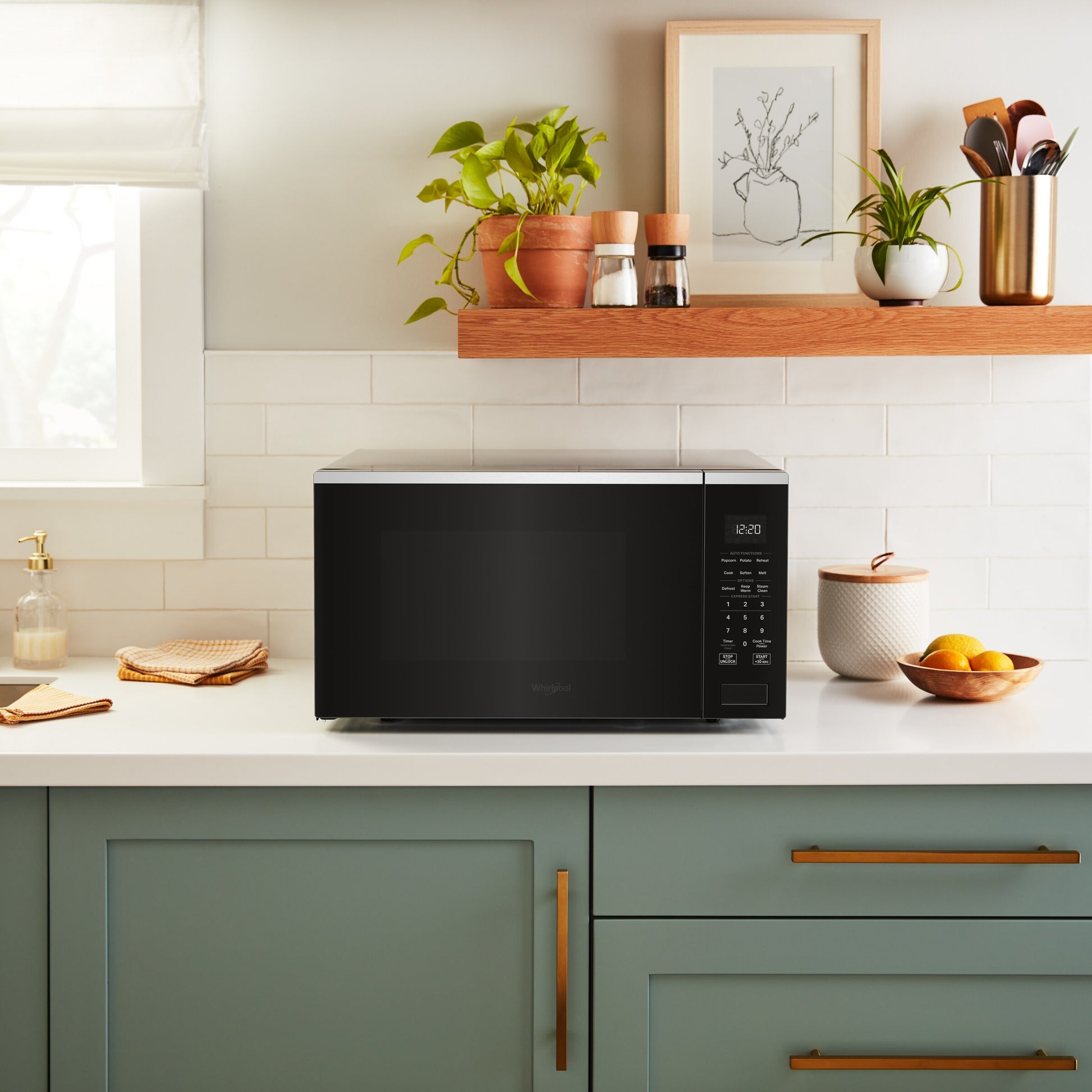 Black sensor cooking microwave with digital keypad on kitchen countertop in modern kitchen and kitchenware setting