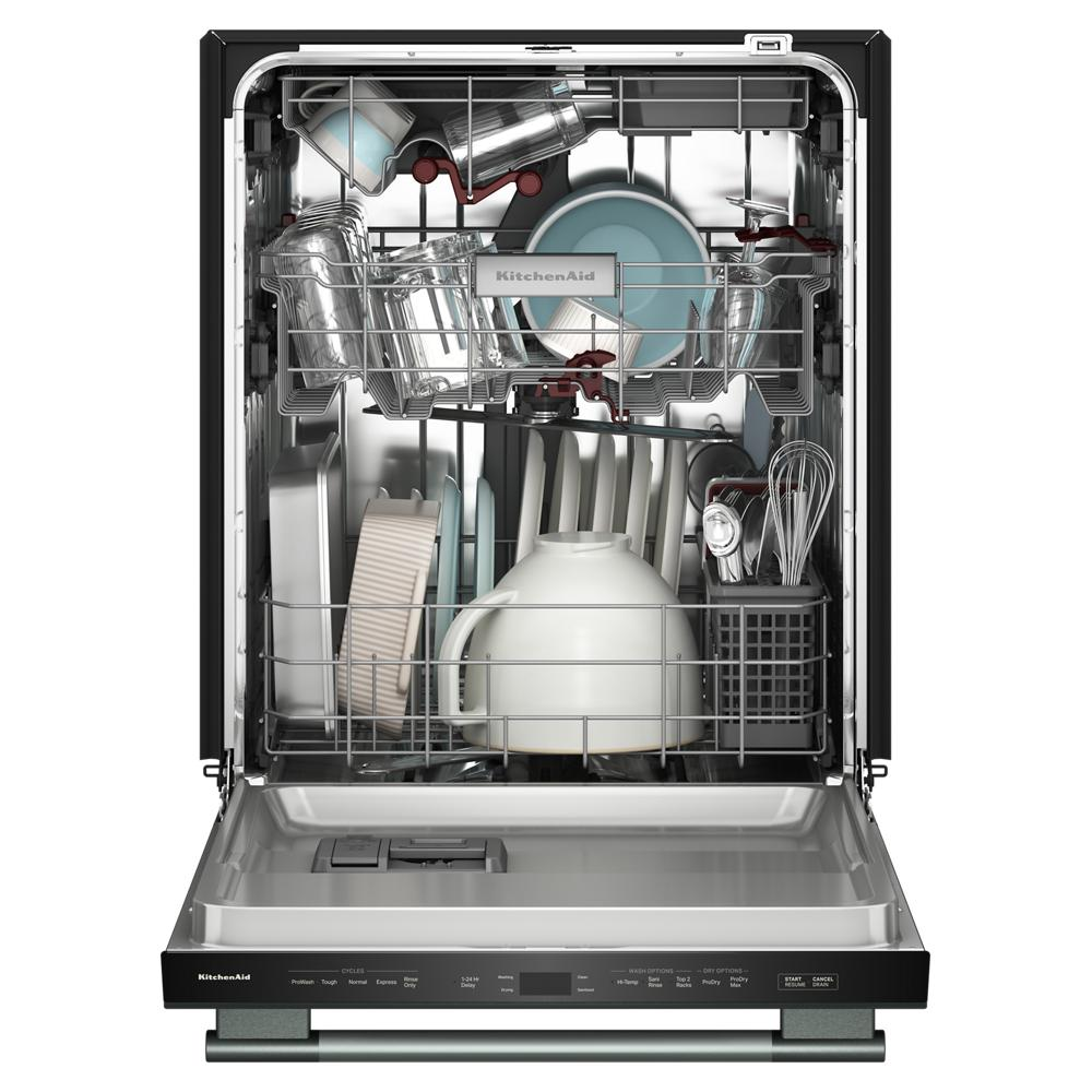 Open KitchenAid built-in dishwasher fully loaded with dishes, glasses, and utensils in stainless steel interior from Appliances collection