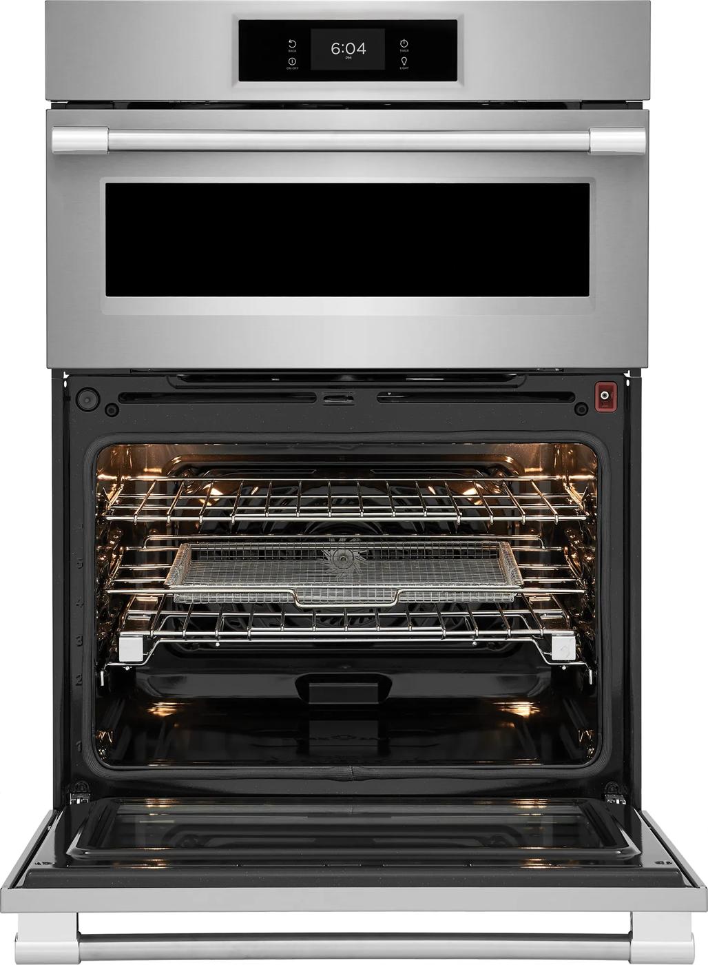 Stainless steel wall oven and microwave combo with open oven door showing interior racks and air fry tray, kitchen appliances