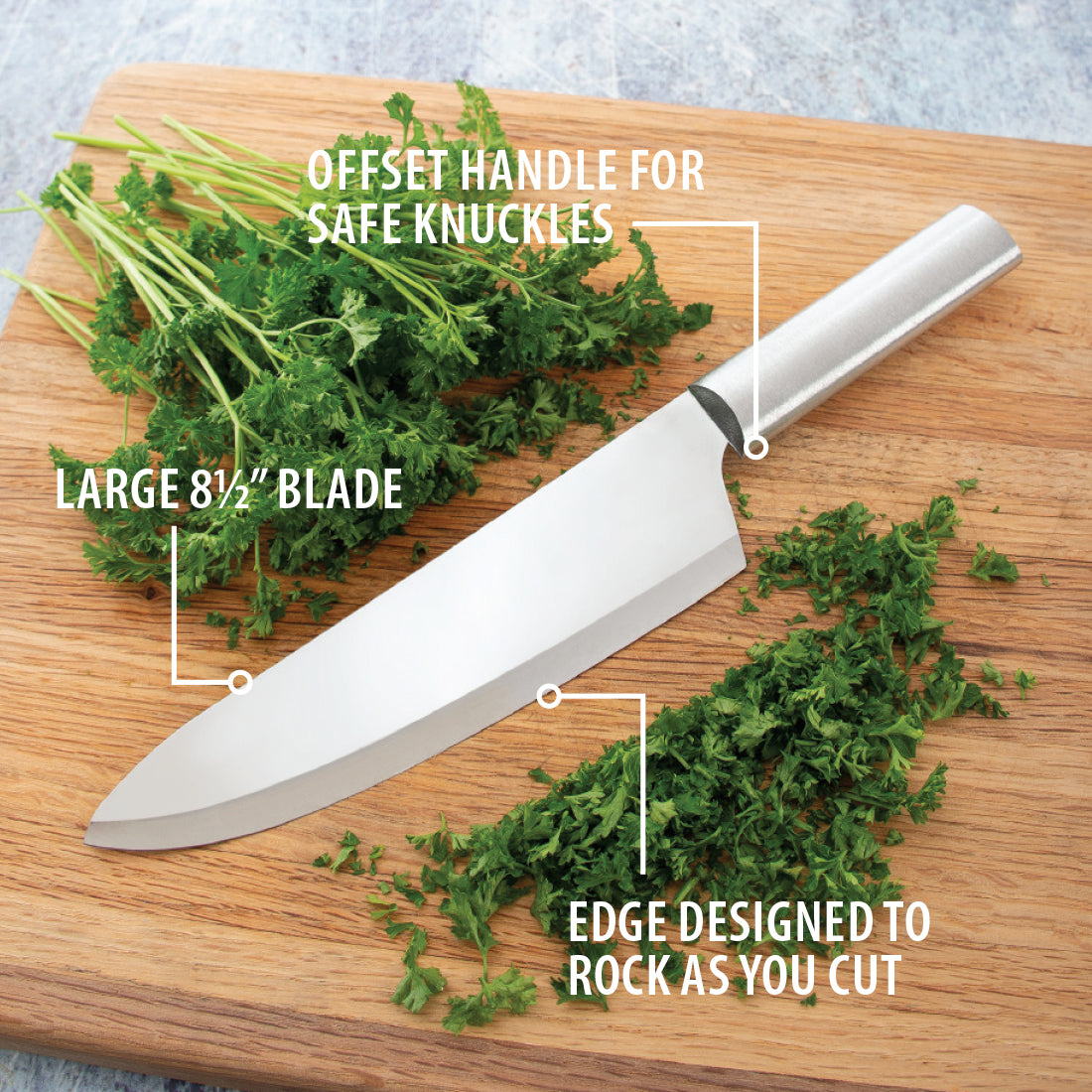 Stainless steel chef knife with large blade and offset handle chopping fresh herbs on wooden board kitchenware collections