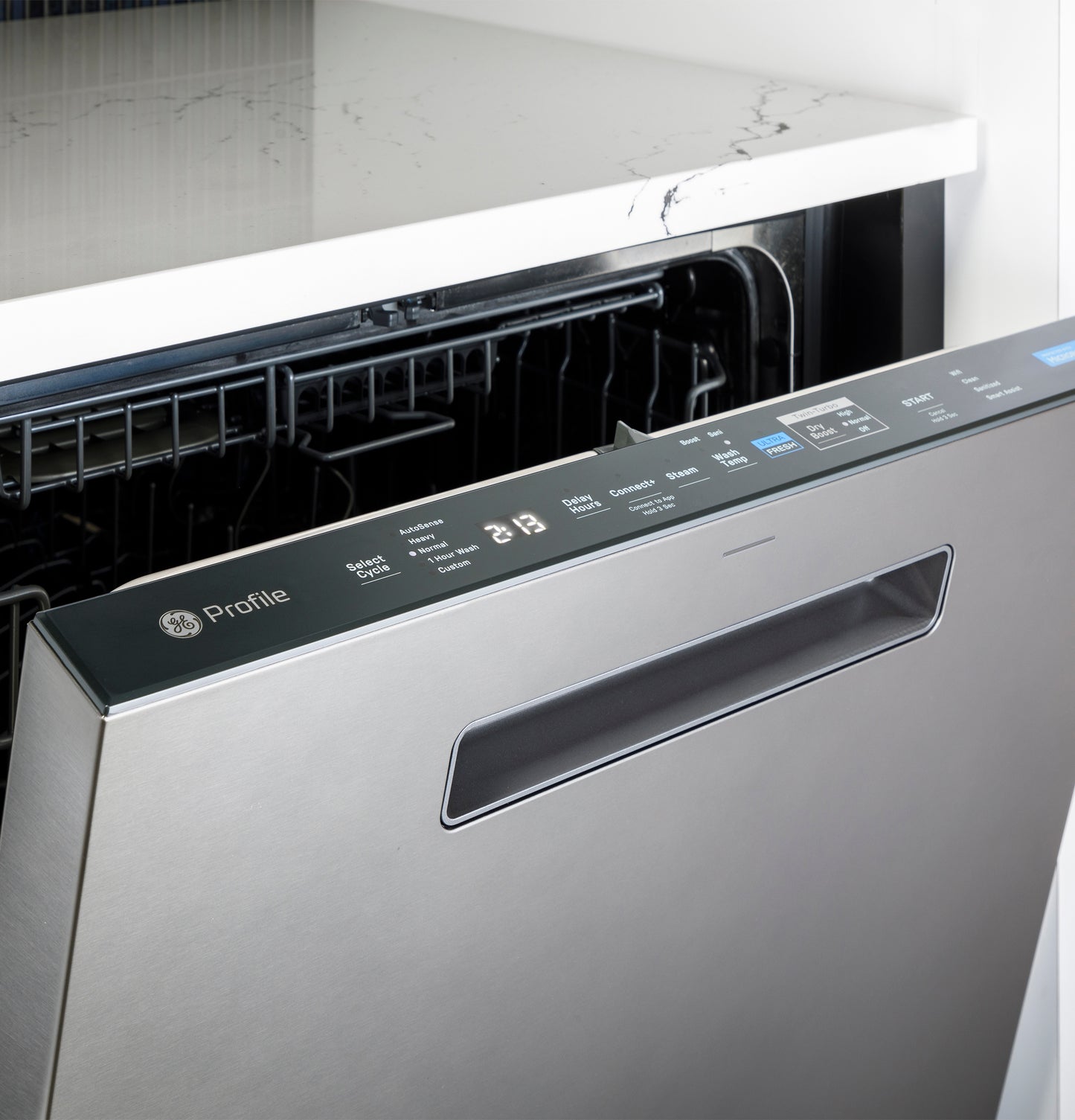 Partially open stainless steel dishwasher from the GE Profile collection showing control panel with cycle options and digital display