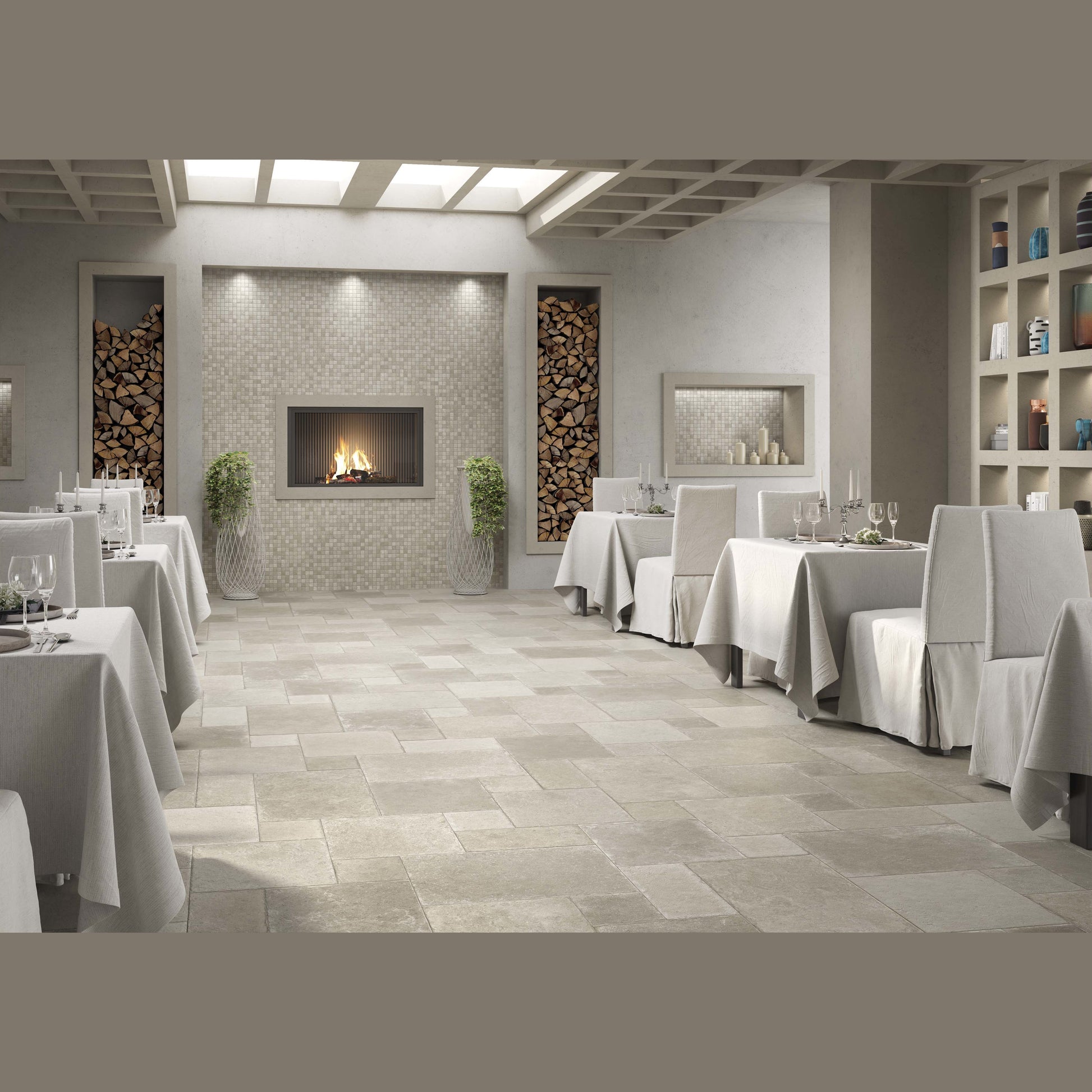 Indoor dining room with matte neutral stone tile flooring and a modern fireplace for home improvement flooring projects