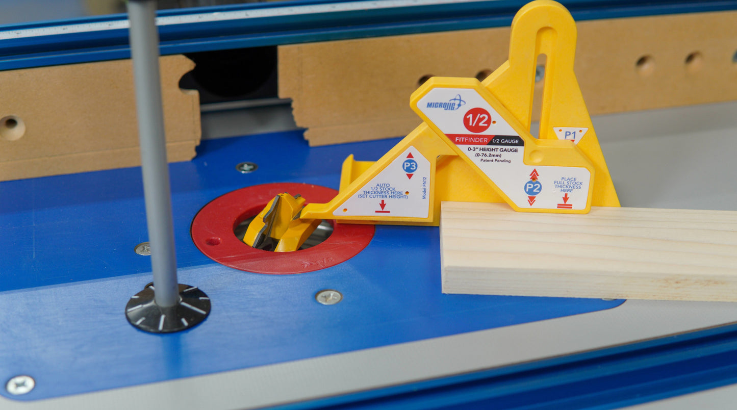 Precision router bit setup guide in yellow plastic for creating accurate lock miter joints on woodworking projects