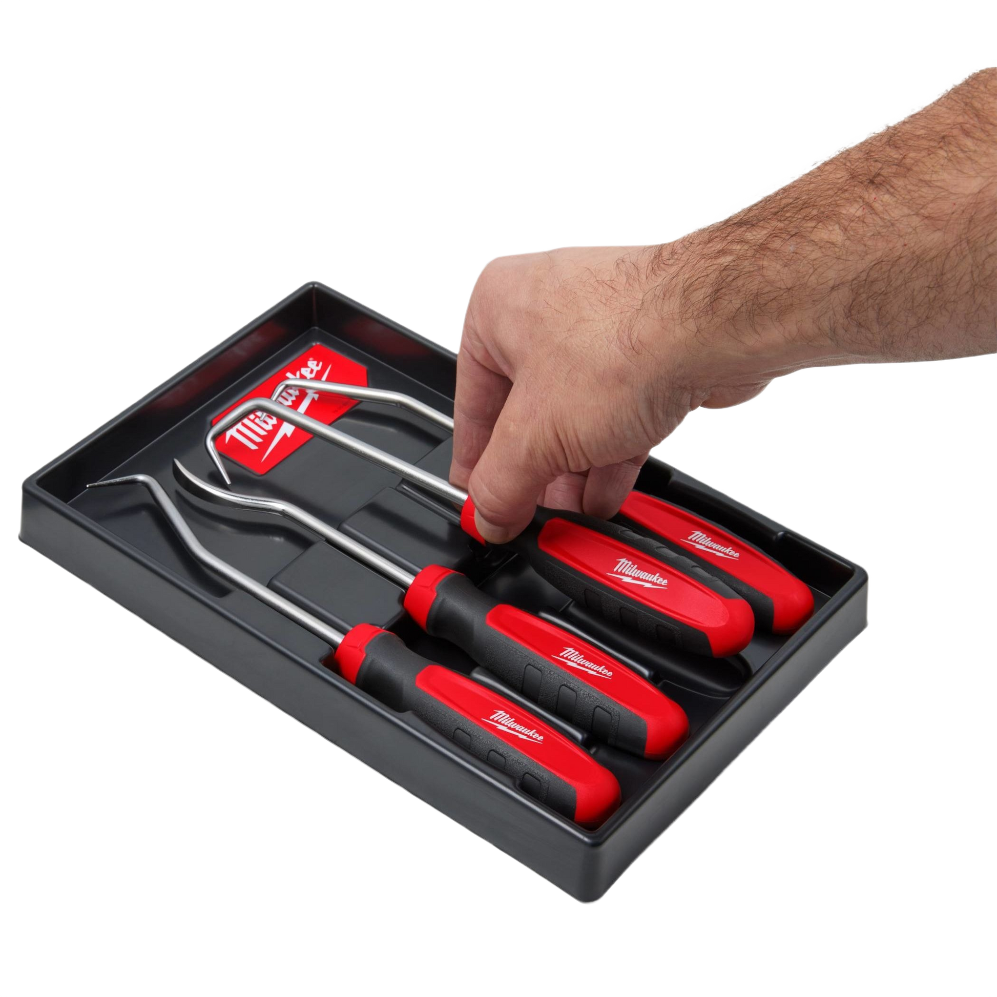 Hand selecting one red and black Milwaukee hose pick tool from a set of four with stainless steel shafts for home improvement tasks