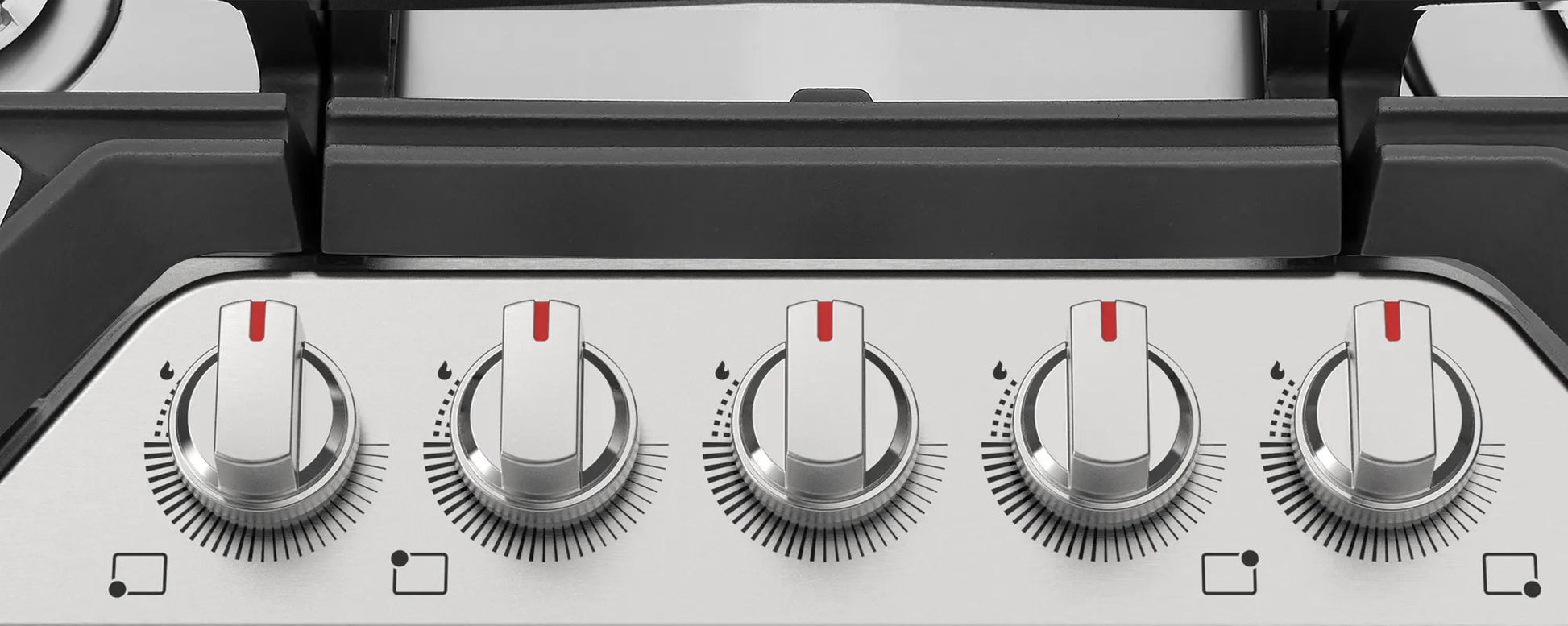 Control panel with five metal knobs for adjustable flame settings on a gas cooktop in Cooktops collection