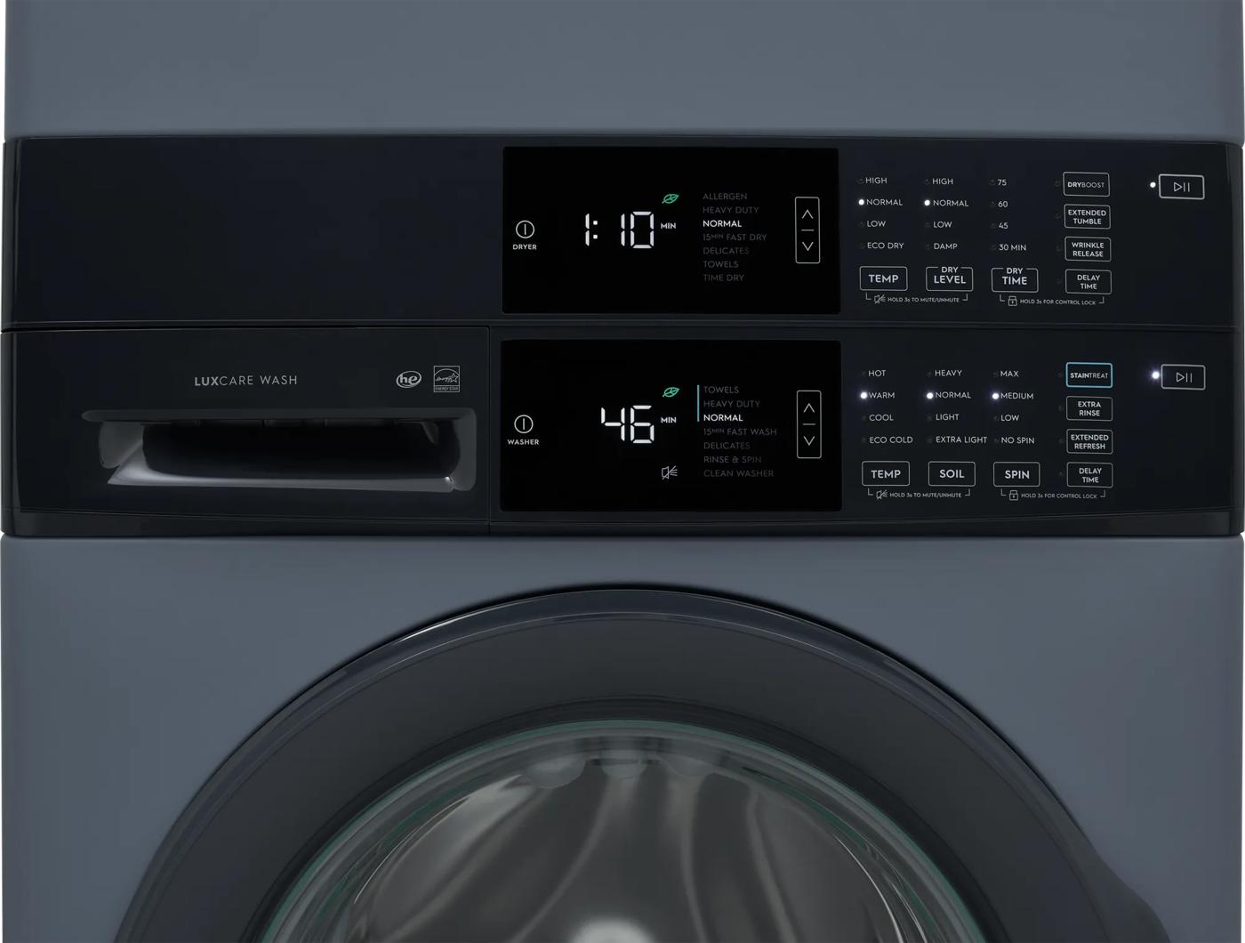 Digital control panels on a gray front load washer and gas dryer combo showing cycle settings and time remaining, part of appliance laundry centers at Hartville Hardware.