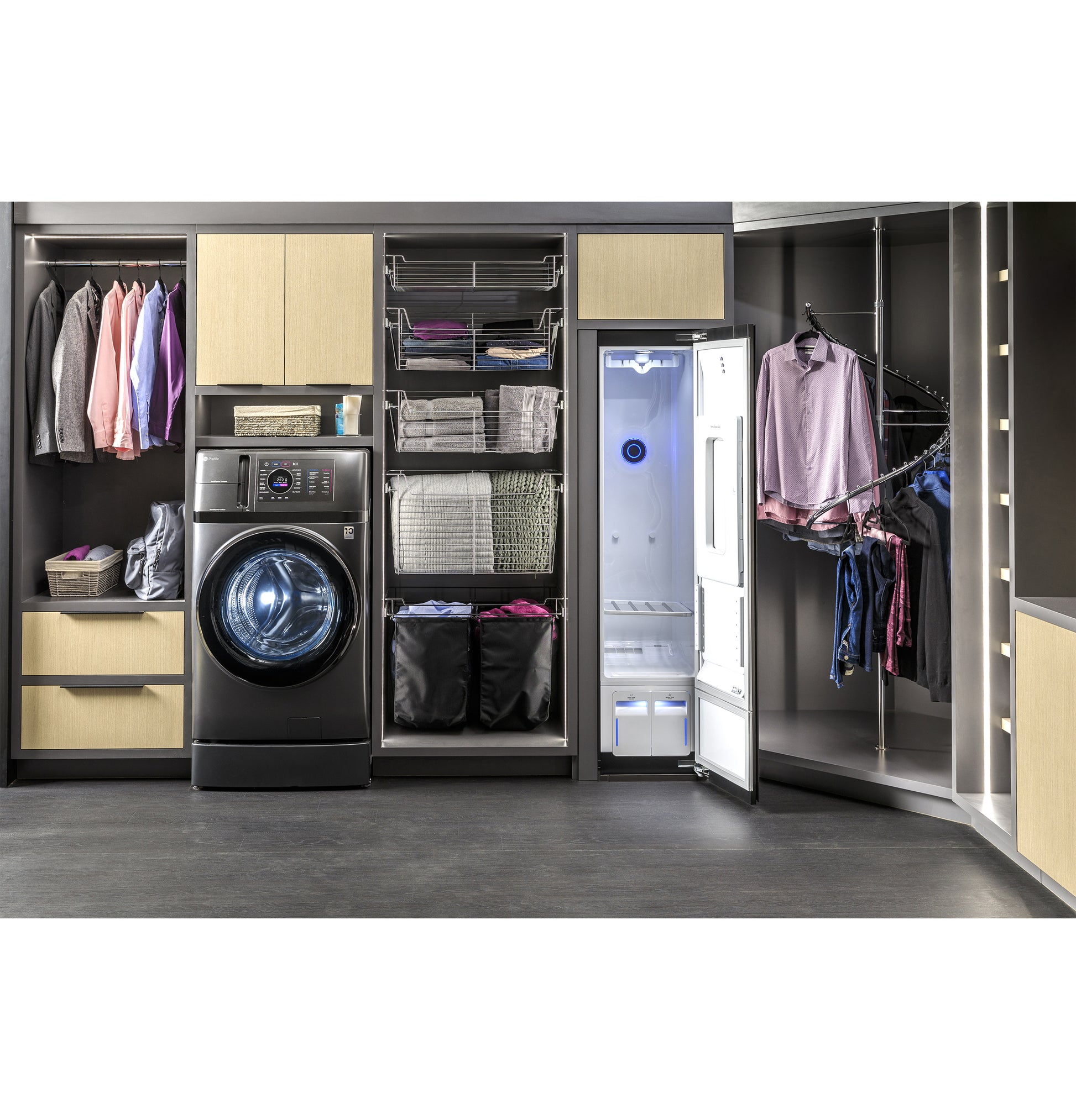 Laundry center with front load washer and open gray steam fabric care closet in modern organized cabinetry setup