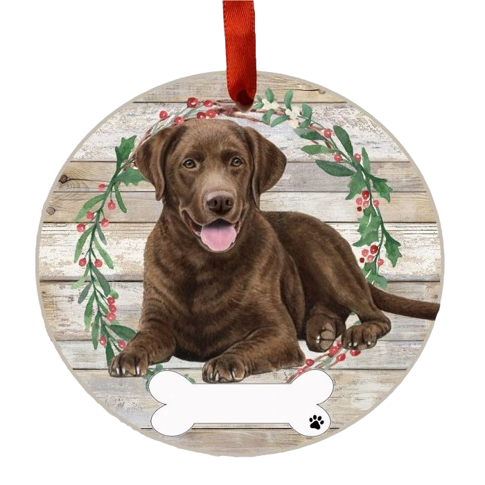 Round wooden Christmas ornament with a happy Chocolate Labrador lying in a wreath of green leaves and red berries