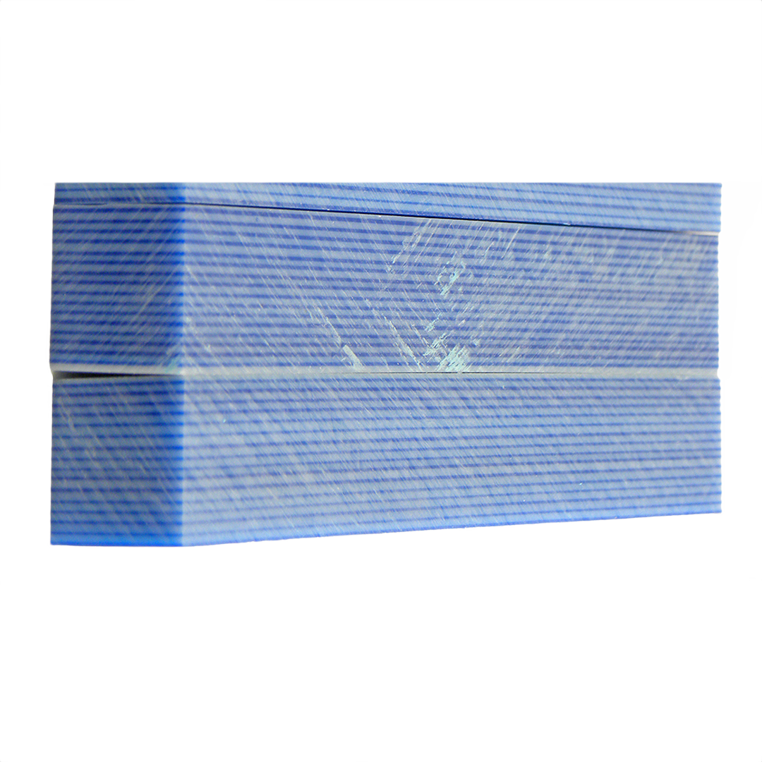 Two rectangular blocks of blue and silvery white pinstriped hardwood for crafting or woodworking projects
