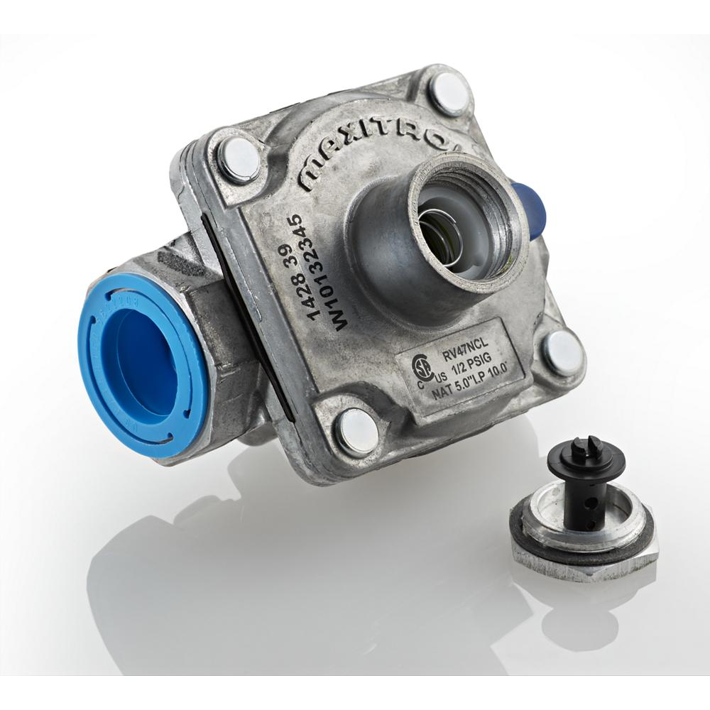 Close-up of metal gas regulator valve with blue plastic fitting and separate black control component in KitchenAid cooktop parts