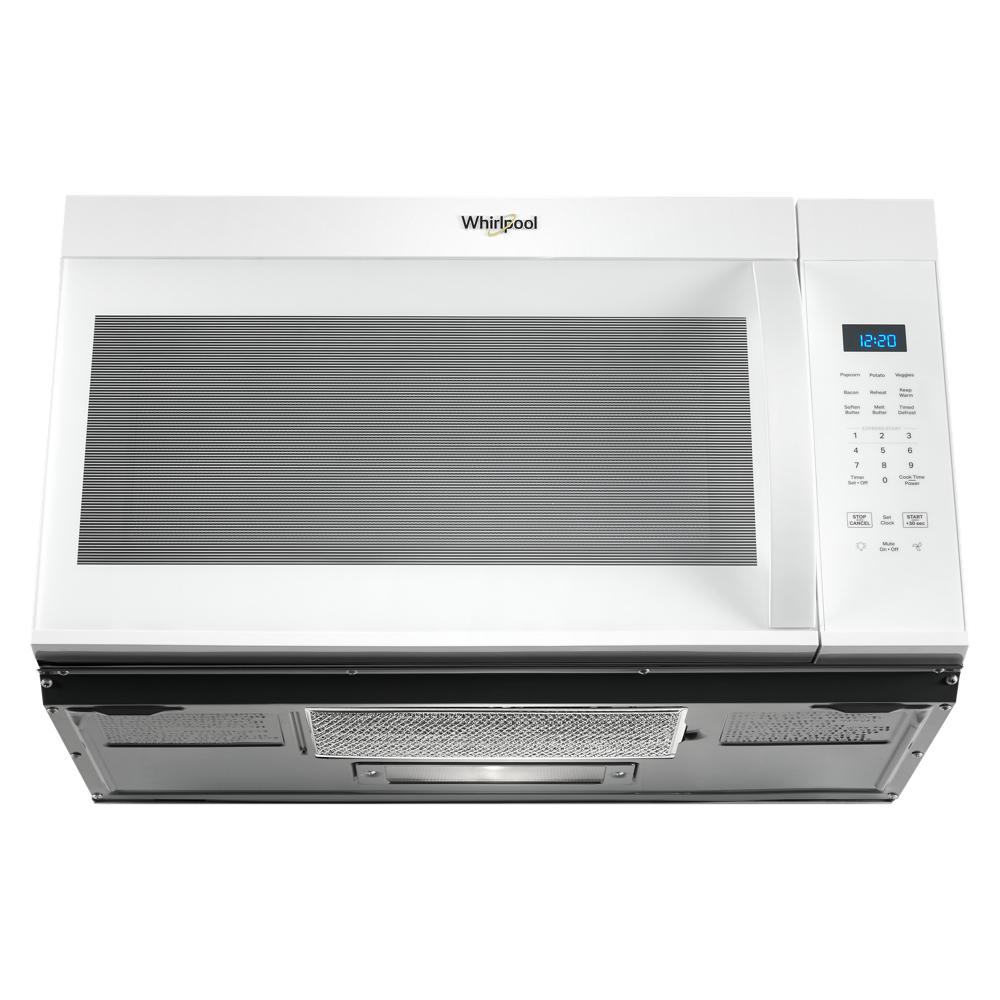 White Whirlpool over-the-range microwave with digital display and control panel in kitchen appliances collection