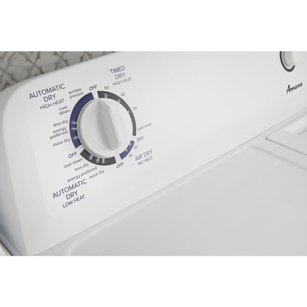 Control knob on white top load electric dryer showing drying cycle options for home improvement appliances collection