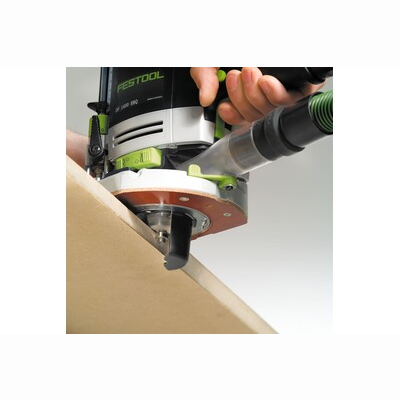 Hand operating a Festool router with dust extraction for precise edge trimming in home improvement projects