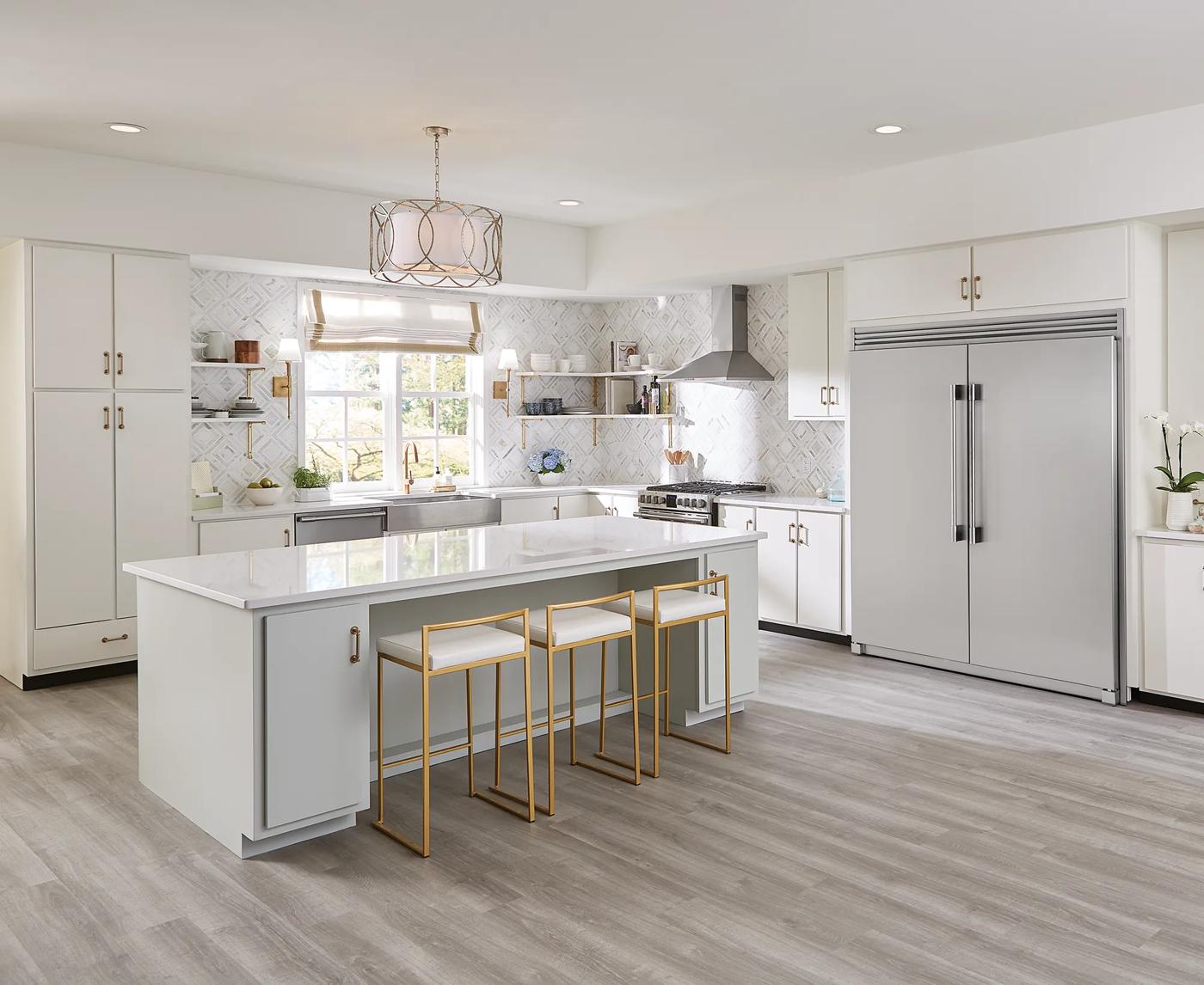 Modern bright kitchen with large stainless steel single-door freezer and white cabinetry in appliances collection