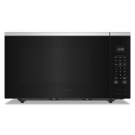 Black Whirlpool sensor cooking microwave with digital control panel and stainless steel accents in kitchen appliances collection