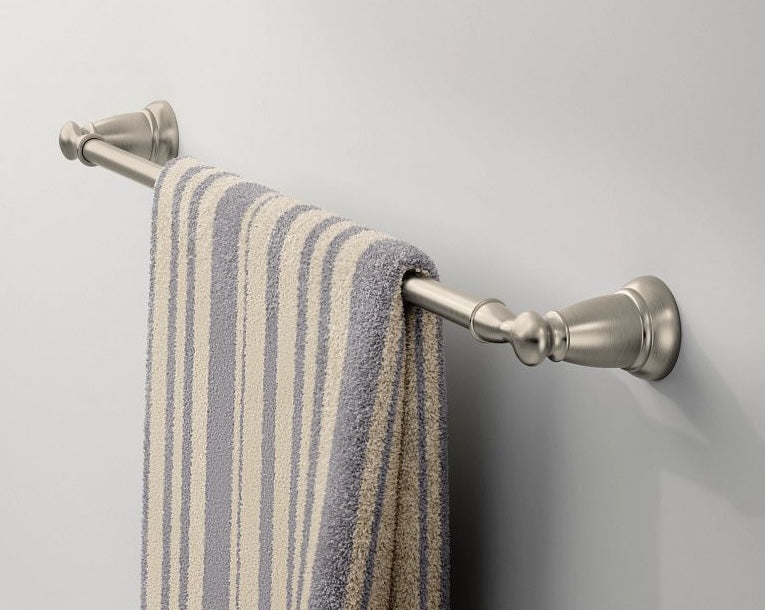 Brushed nickel towel bar with decorative caps holding a striped gray and cream towel for home improvement