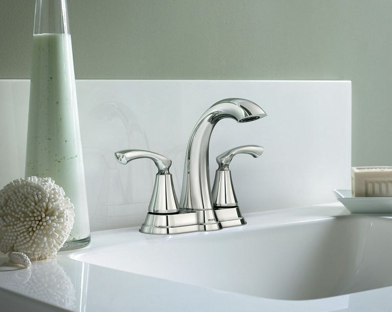 Chrome two handle high arc faucet installed on white bathroom sink in modern bath setting