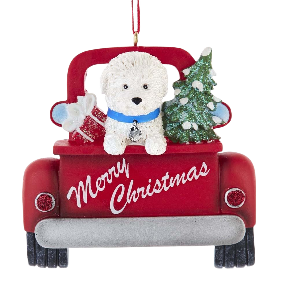 White Bichon Frise with blue collar in red truck carrying Christmas tree and gifts ornament for holiday décor
