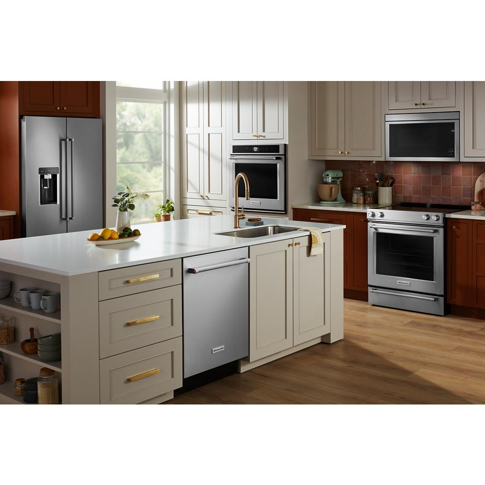 Built-in stainless steel dishwasher with PrintShield™ finish and modern cabinetry in stylish KitchenAid kitchen setting