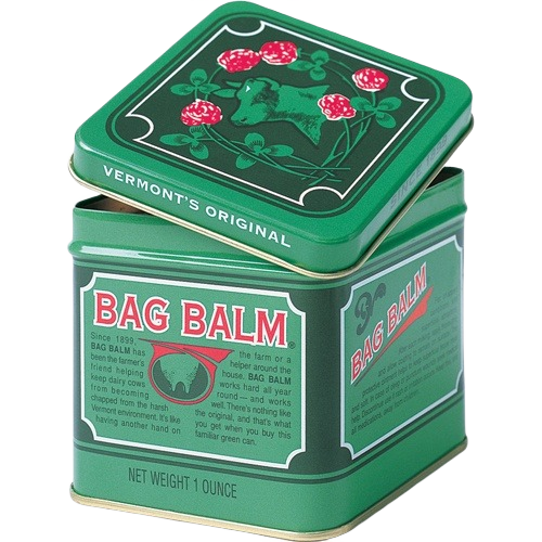 Green vintage-style metal tin container with red and white text and cow illustration for skin balm product