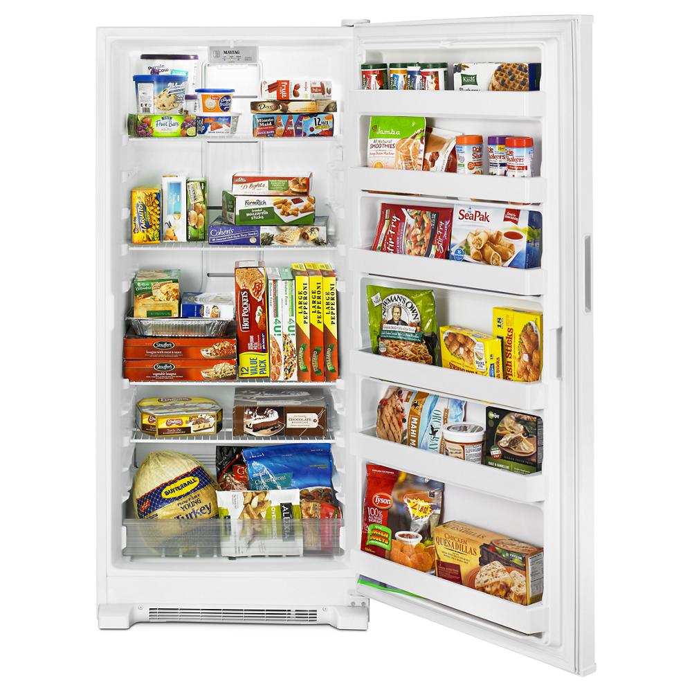 White upright freezer with multiple adjustable shelves and door bins full of frozen food from Freezers & Ice Makers collection