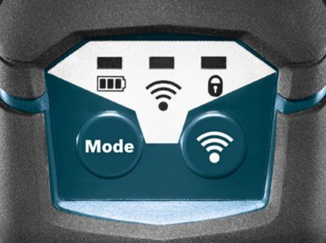 Close-up of control panel with mode and wireless buttons on a Bosch laser level tool for woodworking and measuring tasks