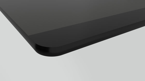 Close-up of sleek black glass surface edge of electric cooktop from Bosch appliances collection