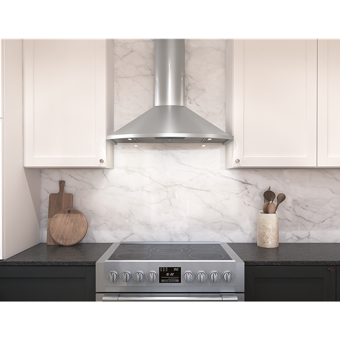 Stainless steel chimney hood with LED lighting above modern electric stove in Over the Range Hoods collection