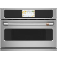 Stainless steel built-in microwave convection oven with digital display and brass-accented handle in kitchen appliances collection