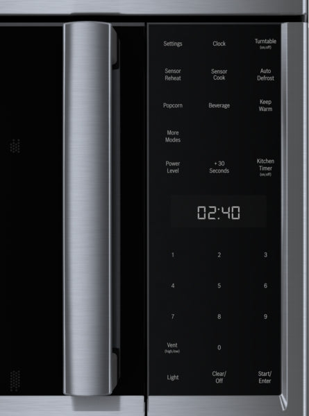 Close-up of stainless steel microwave control panel with digital display and left side-opening door from Bosch appliances collection