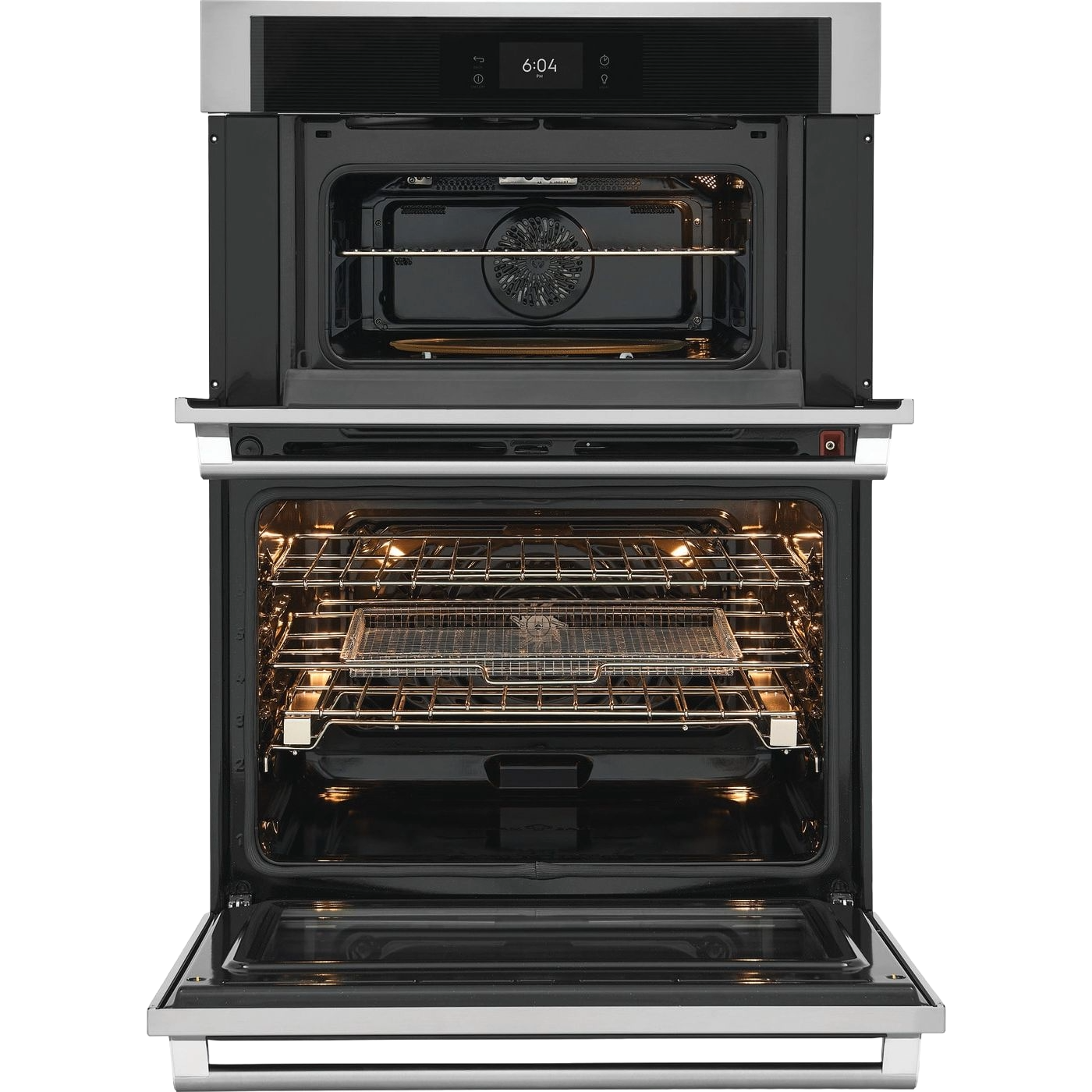 Open stainless steel microwave and wall oven combo with interior lights on in modern kitchen appliance setting