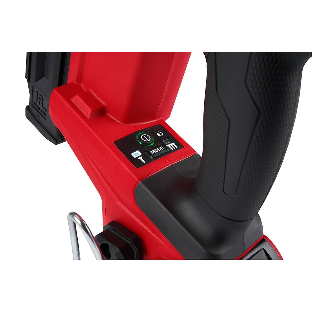 Close-up of red and black 18 gauge brad nailer grip and control panel for precision home improvement tasks