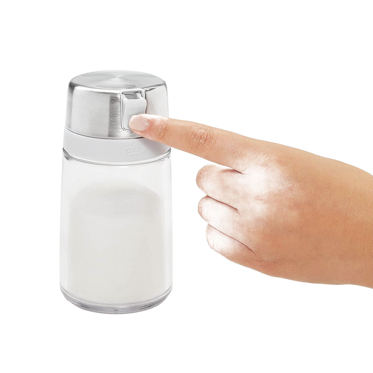 Hand pressing stainless steel top on clear sugar dispenser with white grip for kitchen storage and organization