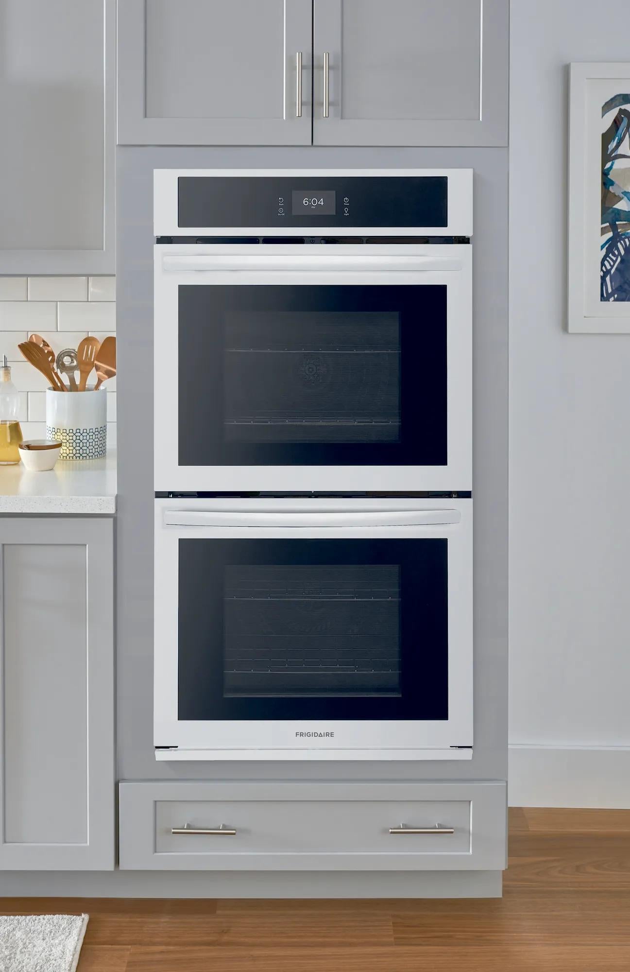 Built-in double electric wall oven with white finish and digital control in modern kitchen and appliances setting