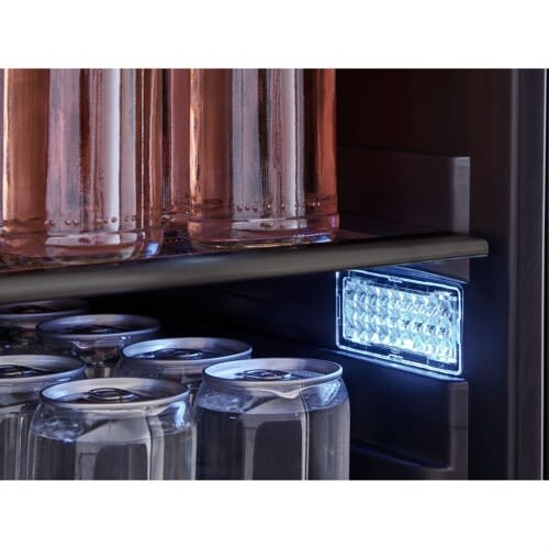 Interior LED light inside an outdoor beverage center illuminating cans and bottled drinks from Appliances collection